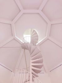 Low angle view of spiral staircase against ceiling