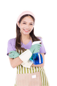 Portrait of a smiling young woman against white background