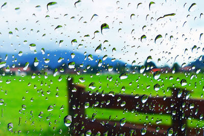 Full frame shot of wet glass window during rainy season