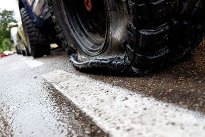 Low section of a high angle view of car on road