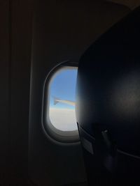 Airplane wing seen through window