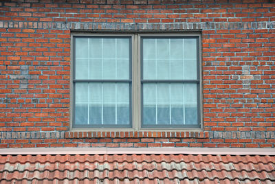 Window on brick wall of building