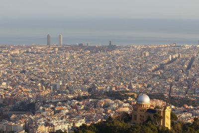 High angle view of city buildings against sky