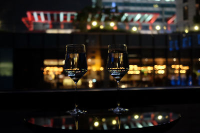Glass of wine bottles on table