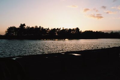 Scenic view of lake at sunset