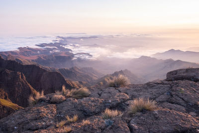 Scenic view of rocky mountains against sky during sunset