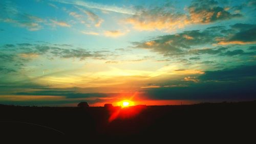 Scenic view of silhouette landscape against sky during sunset