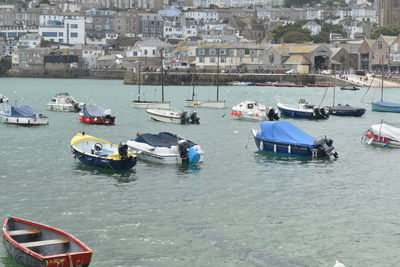 High angle view of boats moored at harbor