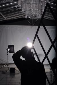 Silhouette photographer working in studio