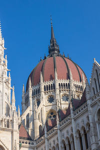 Low angle view of building against blue sky