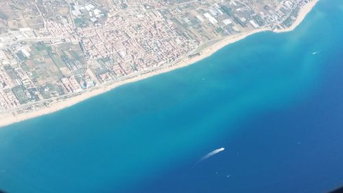 Aerial view of cityscape and sea