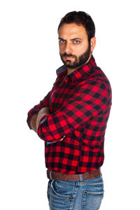 Portrait of young man standing against white background