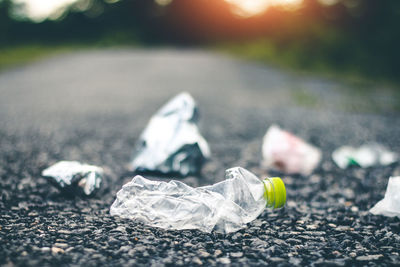 Close-up of garbage on road