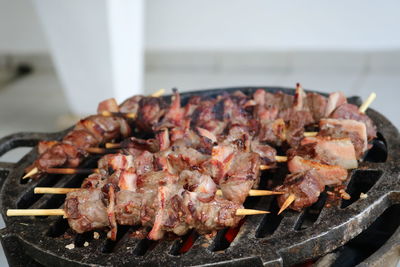 Close-up of meat on barbecue grill