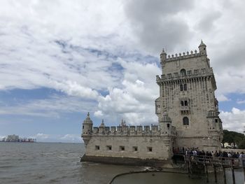 Historic building against cloudy sky