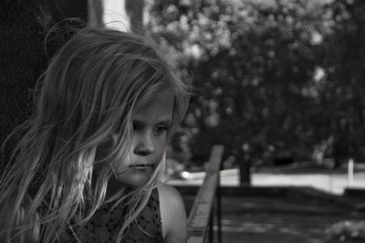 Close-up of cute thoughtful girl looking away