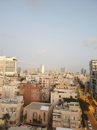 High angle view of buildings in city against sky