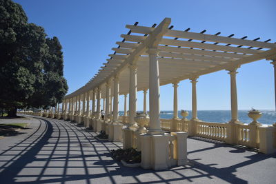 View of colonnade against clear sky