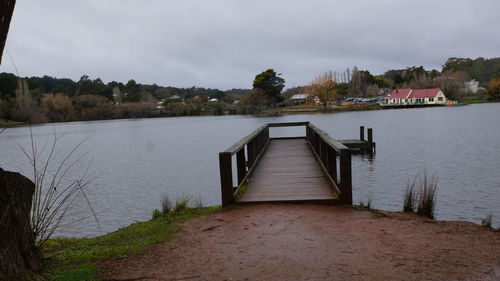 Pier over lake against sky