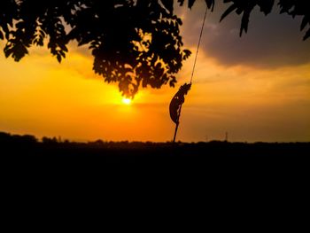 Silhouette tree against sky during sunset