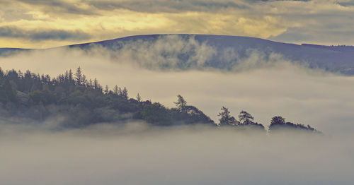 Scenic view of mountains against sky during autumn. 