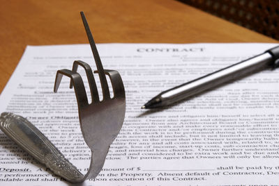 High angle view of pen and book on table