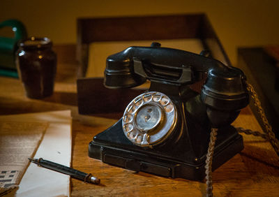 Close-up of telephone on table at home