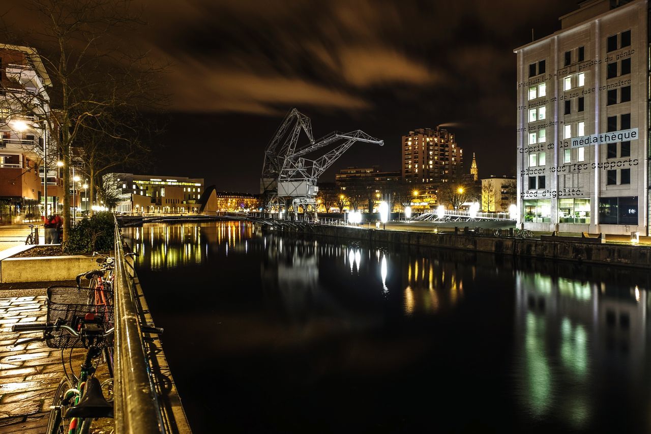 night, reflection, architecture, water, city, illuminated, travel destinations, river, bridge - man made structure, building exterior, waterfront, built structure, cityscape, outdoors, sky, no people, cultures