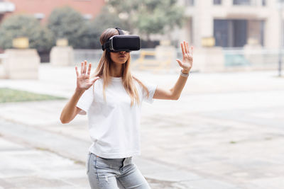 Woman wearing vr headset outdoors