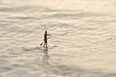 Full length of man surfing in sea