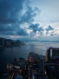 High angle view of cityscape by sea against sky