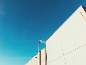 Low angle view of building against blue sky