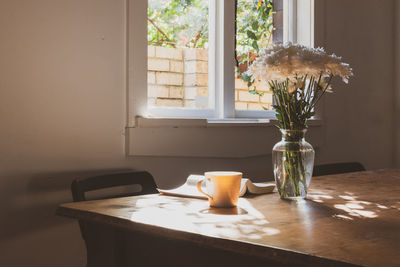 Glass vase on table at home