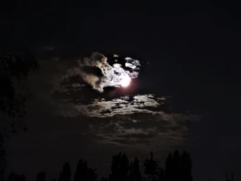 Low angle view of moon in sky at night