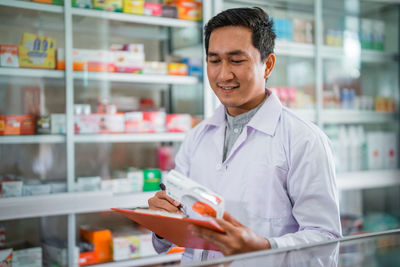 Portrait of young man working in laboratory