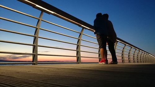 Low angle view of silhouette man against sky