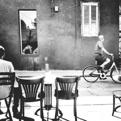 High angle view of woman at sidewalk cafe