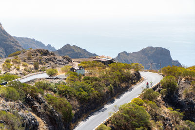 High angle view of road by mountain against sky