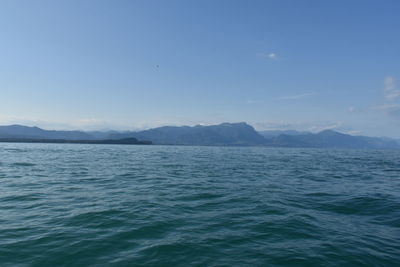 Scenic view of sea against clear blue sky