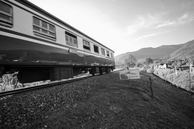 Train on railroad track against sky