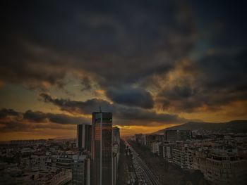 High angle view of illuminated buildings against sky during sunset