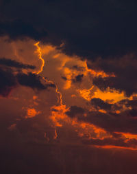 Low angle view of dramatic sky during sunset