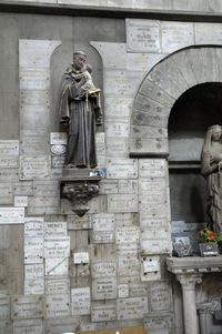 Statue in front of building