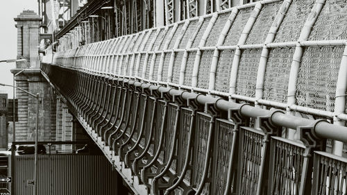 Low angle view of pipes on bridge in city