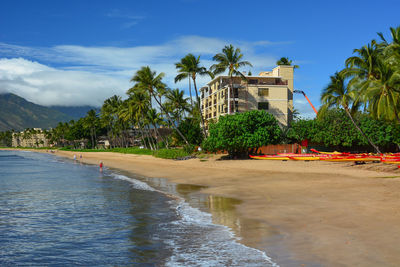 Scenic view of beach by sea against sky