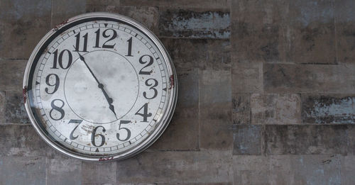 Close-up of clock on wall