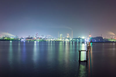 Illuminated city at waterfront