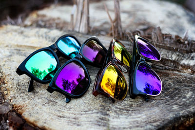 High angle view of sunglasses on tree stump