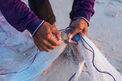 Fisherman holding fishing net