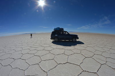 Man on landscape against sky